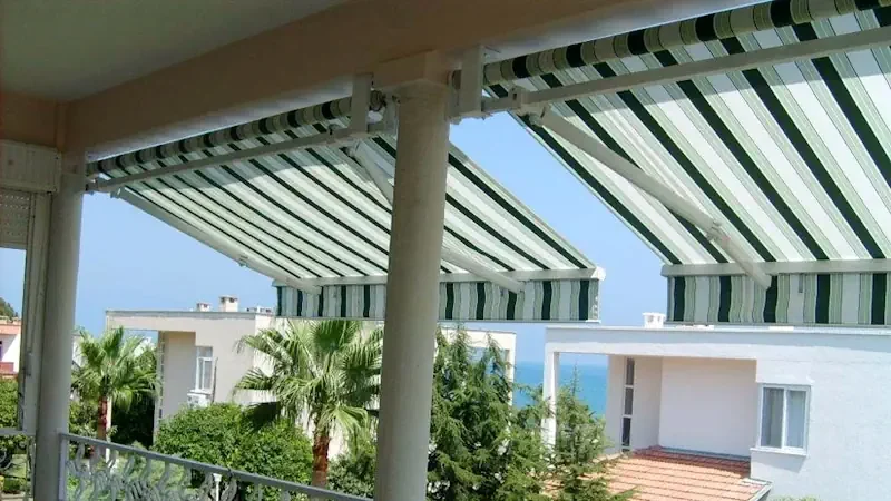 Striped retractable awning on a balcony